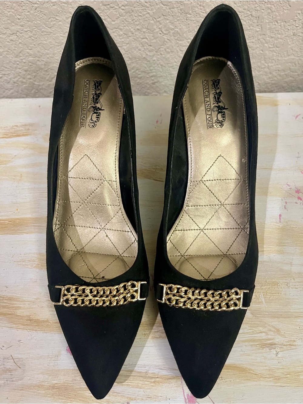 Coach and Four Black Pointed Toe Pumps with Gold Chain Trim